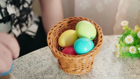Bright painted eggs carefully positioned on springtime display Video stock 330497807