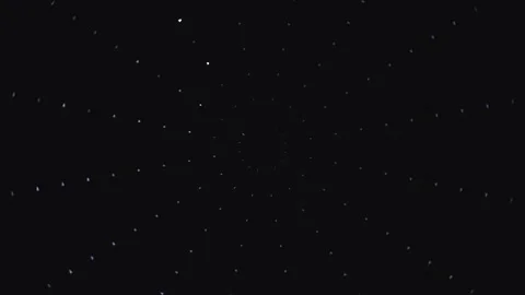 Bright particles moving in a spiral pattern on a dark Stock Footage 339372073