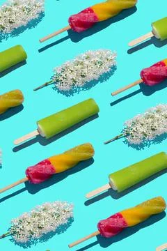 Bright pastel summer pattern ice cream and flowers in a flat lay Stock Photos