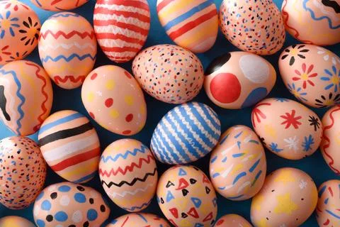 Bright Patterned Easter Eggs on Blue Background 库存照片