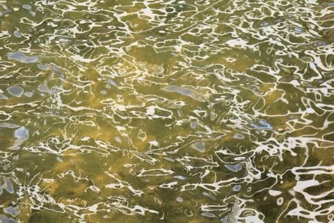 Bright patterns on the water Stock Photos