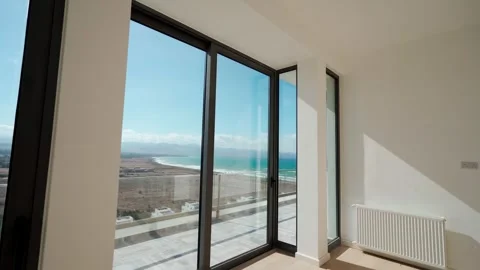 Bright penthouse showcases spacious interior, elegant hardwood floors, large Stock Footage 268620054