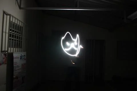 Bright piece of light with an abstract shape illustrated on a dark background Stock Photos