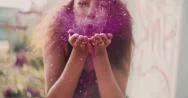 Bright Pink Glitter Being Blown By A Teenage Girl Stock Footage