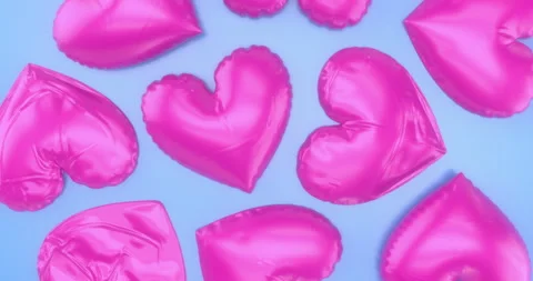 Bright Pink Inflating and Deflating Heart Shaped Balloons Background. Stock Footage 261120631