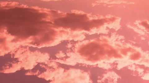 Bright Pink Orange Clouds in Colored Sunset Sky in Sunlight Sun RaysTime Lapse,  Stockbeeldmateriaal 329026589