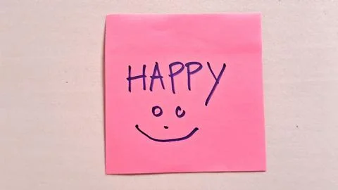 Bright pink sticky note displaying happy text and smiling face Stock Photos