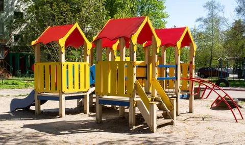 Bright playground on a spring day. Empty playground without people. Stock Photos