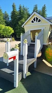 Bright playground structure with a mailbox in Collingwood park. Stock Photos
