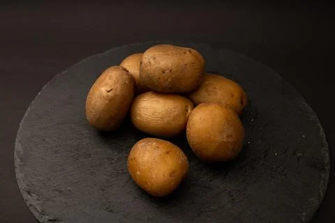 Bright potatoes on a plate Stock Photos