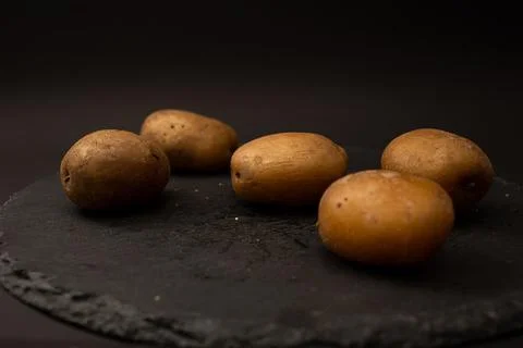 Bright potatoes on a plate Stock Photos