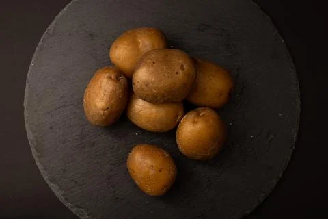 Bright potatoes on a plate Stock Photos