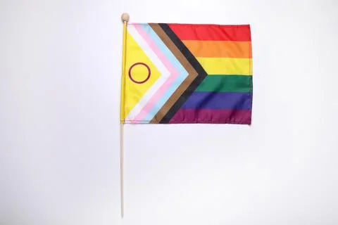 Bright progress flag on white background. LGBT pride Stock Photos