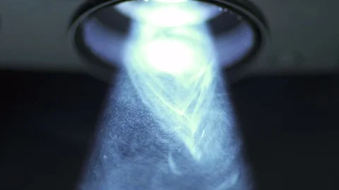 The bright projector illumination with dust particle stream. Macro close up view Stock-Footage 69753971