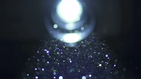The bright projector illumination with dust particle stream. Macro close up view Stock Footage 69756997