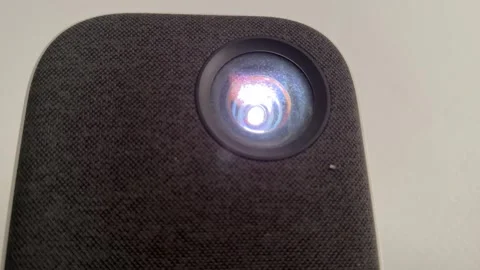 Bright projector lens shining light close up, home cinema and presentation Stock Footage 337120212