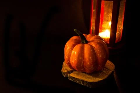 Bright pumpkin on a black background. Halloween and Thanksgiving traditional  Stock Photos