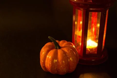 Bright pumpkin on a black background. Halloween and Thanksgiving traditional  Stock Photos