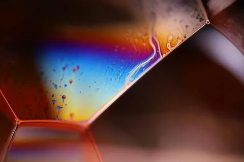Bright rainbow reflection on black background Stock Photos