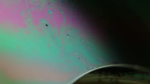 Bright rainbow reflection of liquid in macro, interference pattern Stock Footage 323366834