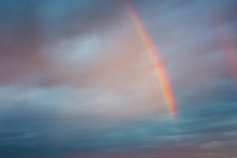 A bright rainbow in the sky Stock Photos