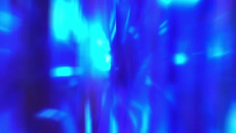 Bright rays of blue neon light glowing lines moving speed through the dark to Stock Footage 253451301
