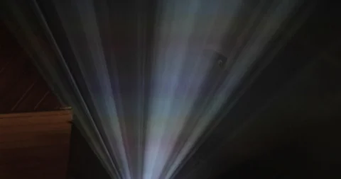 Bright rays of a digital cinema projector in the dark Stock Footage 89053665