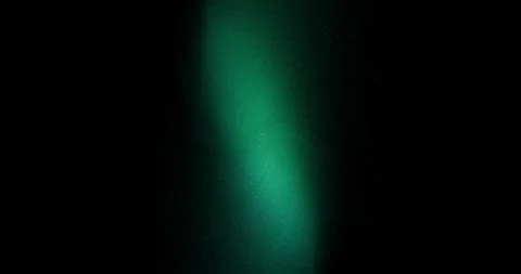 Bright rays of light changing their color on a flashing black background. 스톡 동영상 290032274