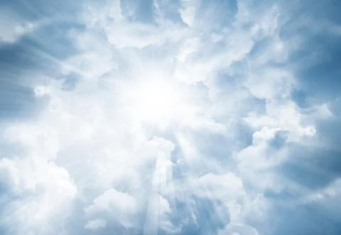 Bright rays shining in clouds Stock Photos