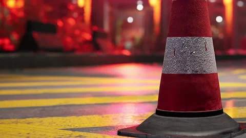 Bright Red and Gray Traffic Cone Standing at Dusk on a City Street Stock Footage 344824649