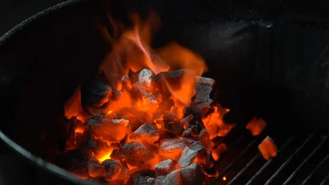 Bright red and orange flame burning in brazier grill. Hot red coal for making Stock Footage 108112725