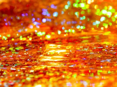 Bright red background. Shiny and sparkling holographic rainbow backdrop. Stock Photos