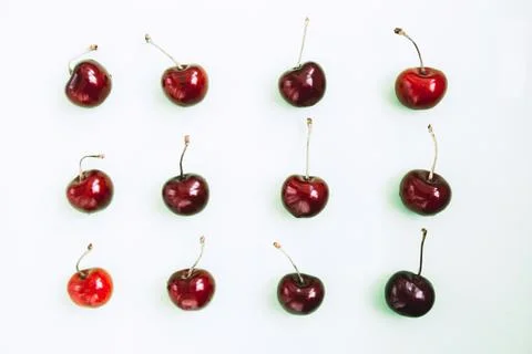 Bright red cherry on light background Stock Photos
