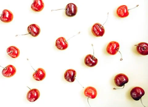 Bright red cherry on a white background Stock Photos