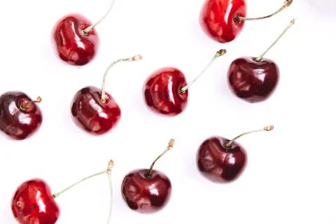 Bright red cherry on a white background Stock Photos
