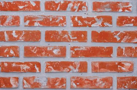 Bright red clay bricks wall flat background pattern Stock Photos
