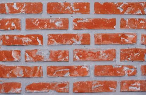 Bright red clay bricks wall flat background pattern Stock Photos