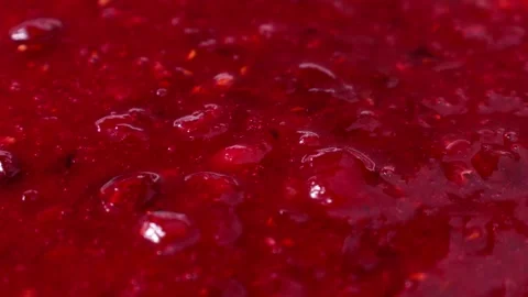 Bright red cranberry sauce texture circle rotation close up Stock Footage 285777646