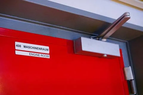 Bright red engine room door 408 on Sylt island ship Stock Photos