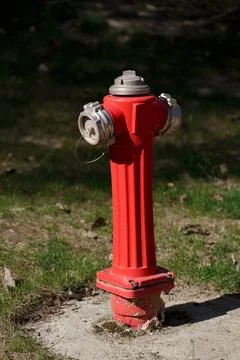 Bright red fire hydrant Stock Photos