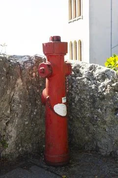 A bright red fire hydrant in San Marino Stock Photos