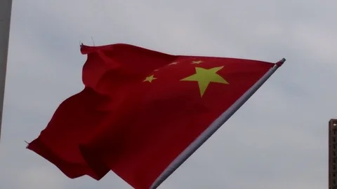 Bright red flags hung on both sides of the road Stock Footage 81377206