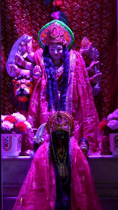 Bright Red Idol of Maa Durga with Ornaments and Crown Stock Footage 316895193