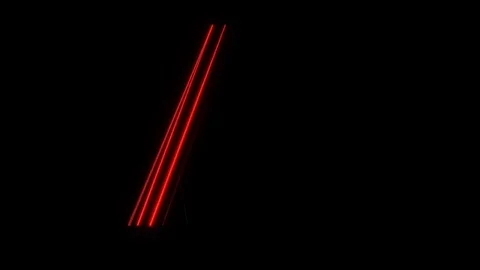 Bright red laser beams moving in black studio Stock Footage 83997337