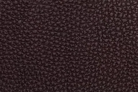 Bright red leather texture background. Closeup photo. Stock Photos