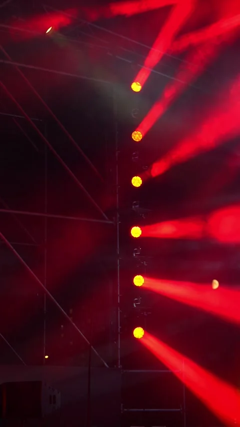 Bright red light beams shining from a vertical row of spotlights. Stock Footage 343242442
