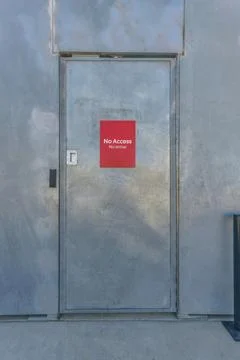 Bright red No Access signage on a shiny door at Waterloo Park Austin Texas Stock Photos