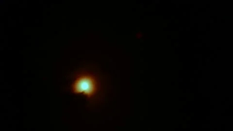 Bright red-orange sun in the black sky, filmed through a sun filter Stock Footage 180968005