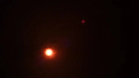 Bright red-orange sun in the black sky, filmed through a sun filter Stock Footage 180968830