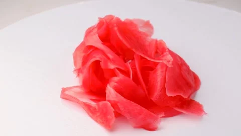 Bright red pickled ginger, rotation in circle. pickled ginger for sushi rolls Stock Footage 277576855